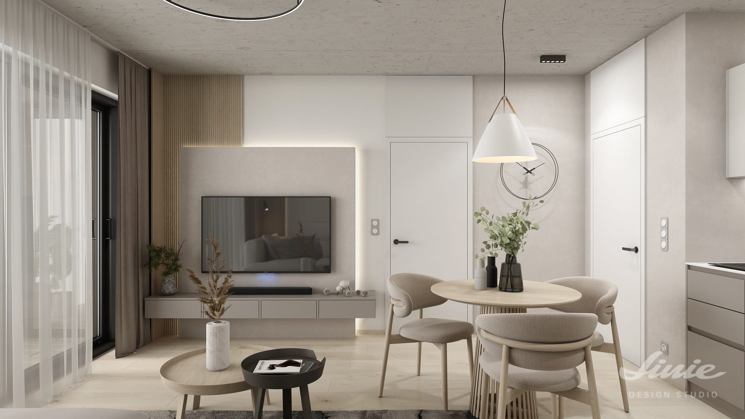 Interiér obývacího pokoje s kulatým jídelním stolem a TV stěnou v minimalistickém japandi designu